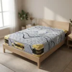 A wooden bed frame with a gray patterned mattress labeled Johari Premium in a bright, minimalist bedroom.